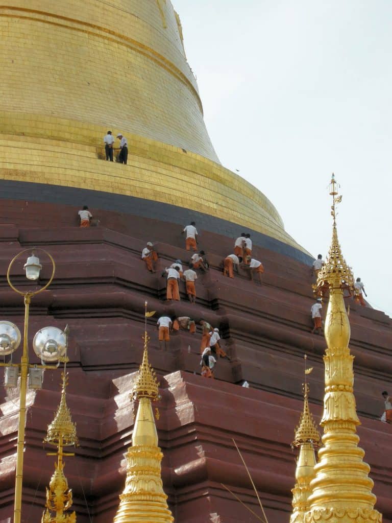 workers restoring stupa at Shwedagon temple