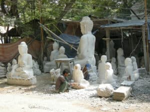 open-air Buddha sculpture workspace in Mandalay