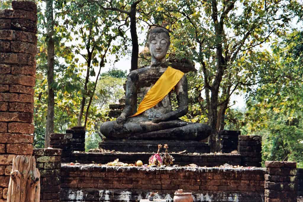 meditating Buddha at temple hill in Si Satchanalai