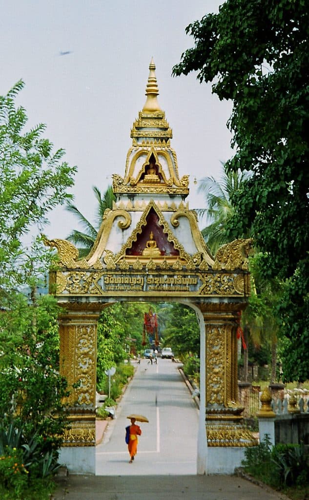 monk leaving Wat That Luang