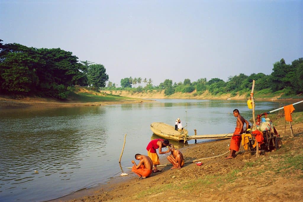 monks shaving at river near Battambang