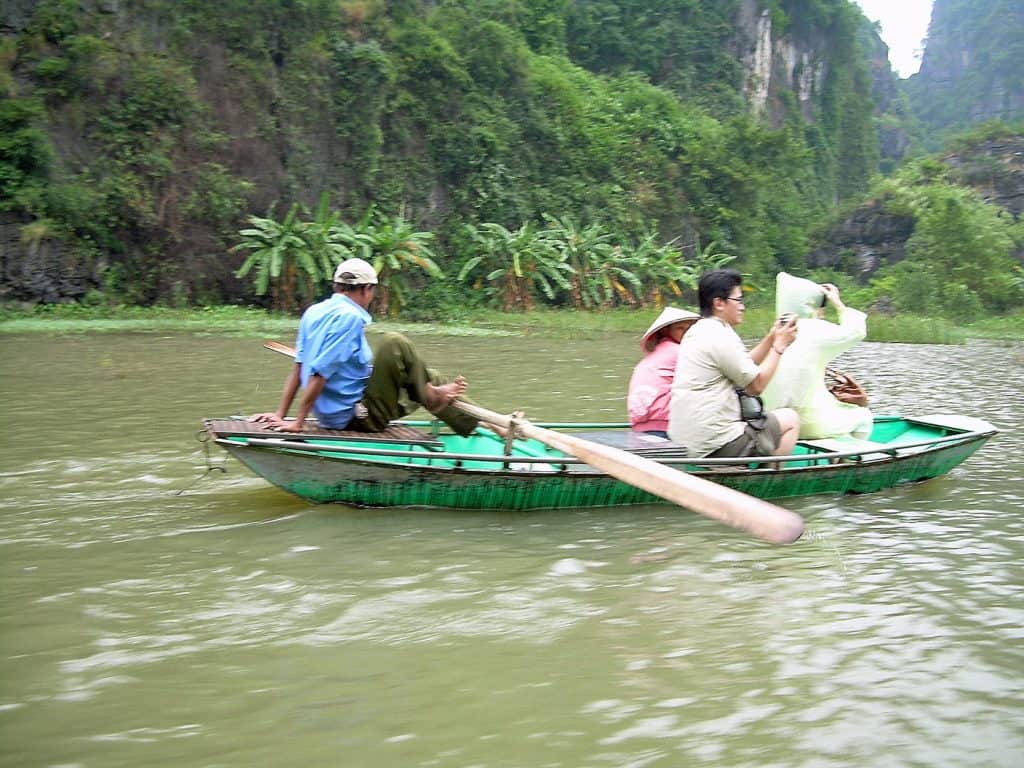in a row boat to Tam Coc