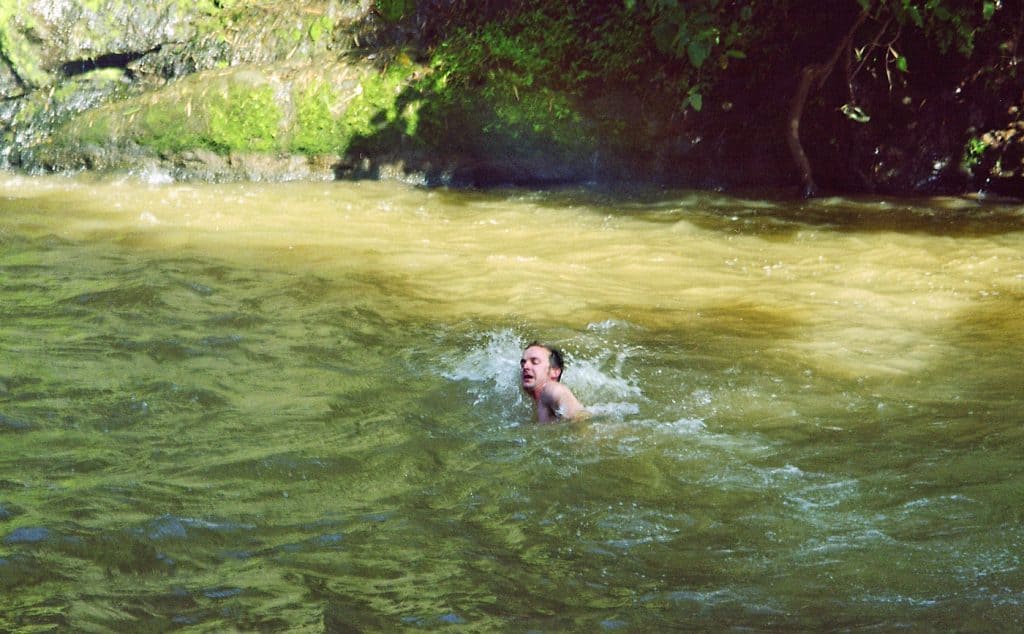swimming at Ka Chanh waterfall near Banlung