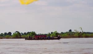 tourist boat trying to spot Irrawaddy dolphins