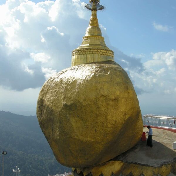 praying in front of Golden Rock Pagoda