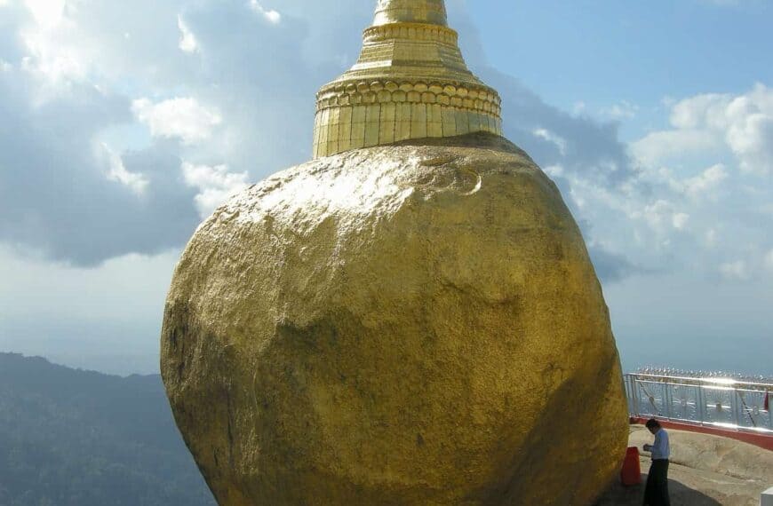 praying in front of Golden Rock Pagoda