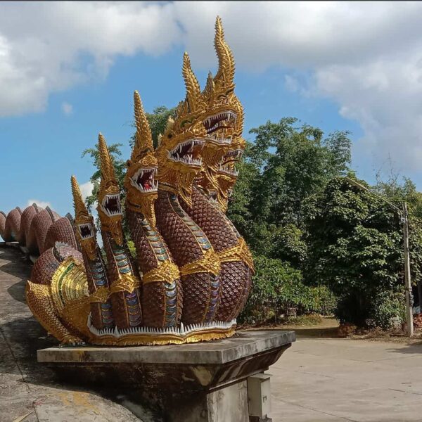 nagas at Buddha footprints temple entrance by Meanwhile in Thailand